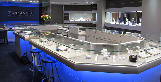 Tanzanite International store interior with glass display cases of tanzanite jewelry 