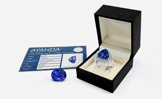 A Ayanda Tanzanite ring in a box with a oval polished cut Tanzanite with an Ayanda Tanzanite certificate