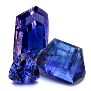 Two rough Tanzanites and a Polished Tanzanite on a white background